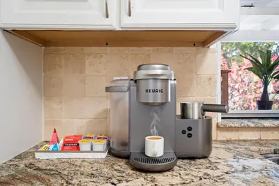a coffee maker on a counter in a kitchen at Sleeps 12 Private Pool & Gameroom near Casino, Beaches & Hard Rock Stadium in Hollywood