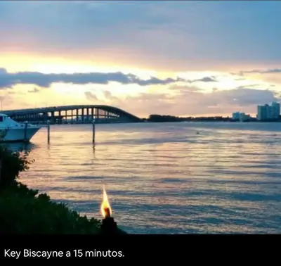 a bridge over a river with a boat in the water at Guest Suite w free parking at 7 min to Miami international airport in Miami