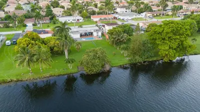 an aerial view of an island in the water at Renovated Sept 2024! Pool - Mini Golf - Volleyball in Joe Robbie Stadium Heliport