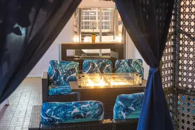 a room with two chairs and a table with lights at Renovated Sept 2024! Pool - Mini Golf - Volleyball in Joe Robbie Stadium Heliport