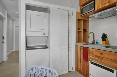 a small kitchen with a sink and a refrigerator at Miami Flats - Self Check-in and 1 Free Parking in Miami