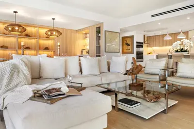 a living room with a white couch and a table at 2 Bedroom Private Residence at Roney Palace -6072B in Miami Beach