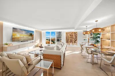 a living room with white furniture and a dining room at 1 Bedroom Plus Den Private Residence at Roney Palace -608 in Miami Beach