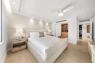 a white bedroom with a bed and a couch at 5 Bedrooms Private Residence at Roney Palace -6078 in Miami Beach