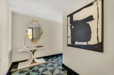 a hallway with a table and a mirror at Stunning Apartment at Icon with Bay Views-Pool-Gym-Spa in Miami