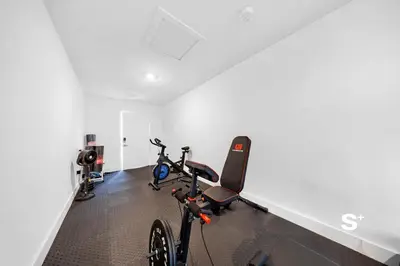 a bike parked in a room with a gym at Modern Studio - Gym & Parking Close to Aventura in Miami