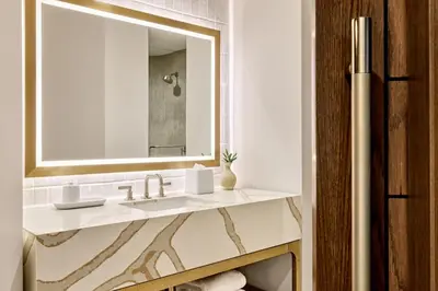 a bathroom with a sink and a mirror at Omni Fort Lauderdale Hotel in Fort Lauderdale