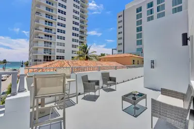 a balcony with chairs and a view of the beach at Penthouse EDEN 2BR with ocean view in Fort Lauderdale