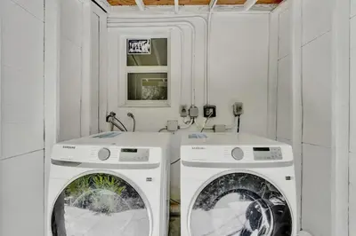 two white washing machines in a white room at Penthouse EDEN 2BR with ocean view in Fort Lauderdale