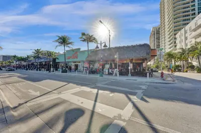 an empty street in a city with a building at Eden Collection Studio Steps to Beach in Fort Lauderdale
