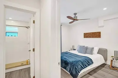 a bedroom with a bed and a ceiling fan at 2102 Eden Collection 1BR Kitchen Steps to beach in Fort Lauderdale