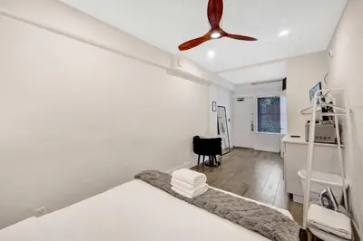 a bedroom with a bed and a ceiling fan at Eden Escape Walk to FLT Beach 2105 in Fort Lauderdale