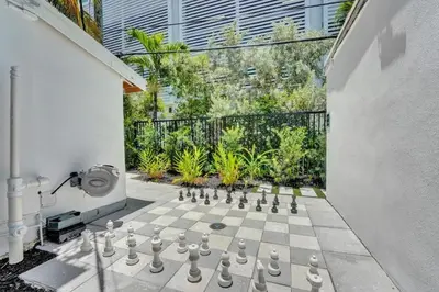 a chess board is on a patio with a chessboard at Eden Escape Walk to FLT Beach 2101 in Fort Lauderdale