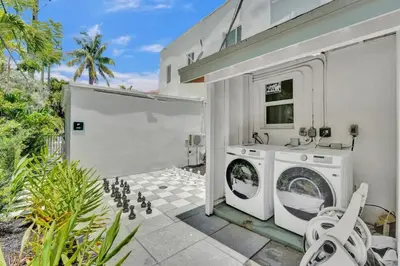 a laundry room with a washer and dryer at Eden Escape Walk to FLT Beach 1206 in Fort Lauderdale