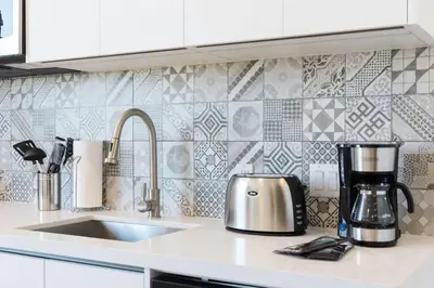 a kitchen counter with a coffee maker on a counter top at 2BR South Beach | Moderno & Aconchegante in Miami Beach