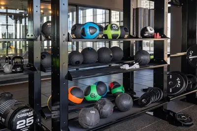 a shelf filled with lots of helmets in a gym at Deluxe 2 bed with Amazing views in Miami
