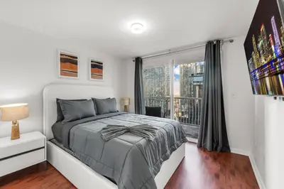 a bedroom with a bed and a large window at Perfectly Located Miami 3BR with Stunning Views in Miami