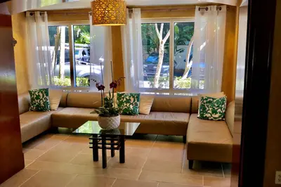 a living room with a couch and a window at Grove Cove - Pool Parking Central Coconut Grove in Miami