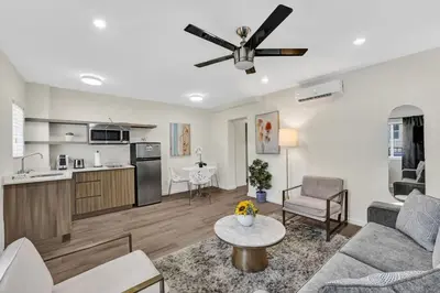 a living room with a couch and a ceiling fan at Eden Escape 1 BR 2201 Walk to FLT Beach in Fort Lauderdale