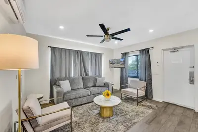 a living room with a couch and a ceiling fan at Eden Escape 1 BR 2201 Walk to FLT Beach in Fort Lauderdale