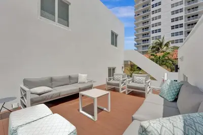 a living room with a couch and a table at Eden Escape 1 BR 2201 Walk to FLT Beach in Fort Lauderdale