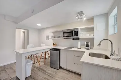 a kitchen with a sink and a counter top at Eden Escape 1 BR 2202 Walk to FLT Beach in Fort Lauderdale