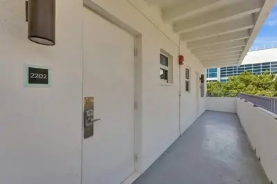 an empty hallway of a building with white walls at Eden Escape 1 BR 2202 Walk to FLT Beach in Fort Lauderdale