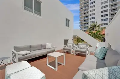 a living room with a couch and a table at Eden Escape 1 BR 2202 Walk to FLT Beach in Fort Lauderdale
