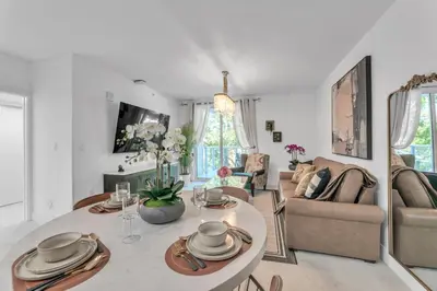 a living room with a table and a couch at Lux 2BR City-View Retreat in Hollywood, 2nd Floor in Hollywood