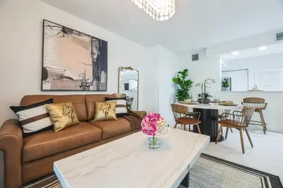 a living room with a couch and a table at Lux 2BR City-View Retreat in Hollywood, 2nd Floor in Hollywood