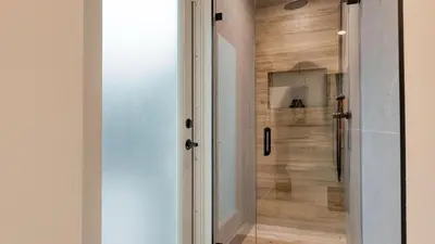 a glass door leading to a shower in a bathroom at Luxury Waterfront Home w Pool Hot Tub Dock Near Las Olas Gulfstream in Fort Lauderdale
