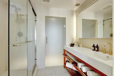 a bathroom with a sink and a shower at Beach Club - Oceanfront Luxury, Resort Amenities, Balcony Views in Fort Lauderdale