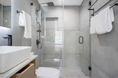 a bathroom with a shower and a toilet and a sink at Private Suite At Villa Verde Miami in Miami
