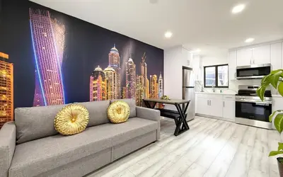 a living room with a couch and a city mural at Little Havana Paradise in Miami