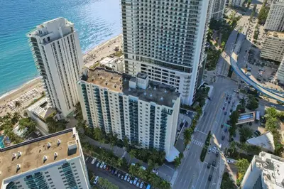 an aerial view of tall buildings next to the ocean at Luxury Oceanfront 2 Bedroom ON THE BEACH 3 FLOOR in Hollywood