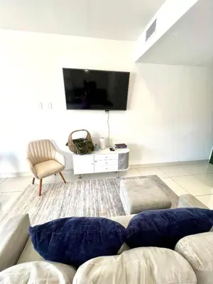 a living room with a couch and a tv at 3BR Townhouse, Miami and the Keys in Homestead
