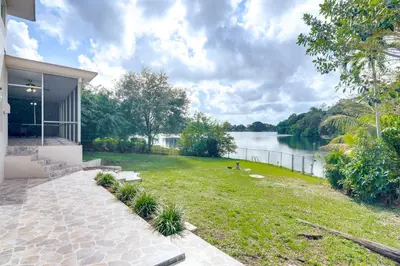 a house with a view of the water at 8 Mi to Wynwood Waterfront Retreat with Lanai in Miami