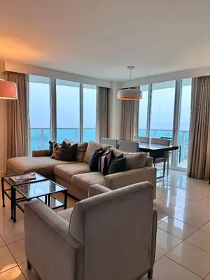 a living room with a couch and a table at Breathtaking Direct Bay Views 2 bedroom condo with parking in Miami