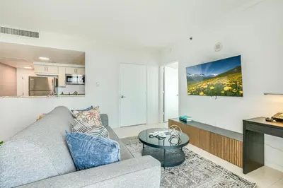a living room with a couch and a table at 2 bedroom Bay View Beauty in Coconut Grove- Parking for 2 cars included! in Miami