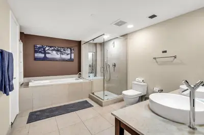 a bathroom with a tub and a toilet and a sink at Icon brickell The W hotel residence in Miami
