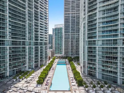 an aerial view of a pool in a city with tall buildings at Icon brickell The W hotel residence in Miami