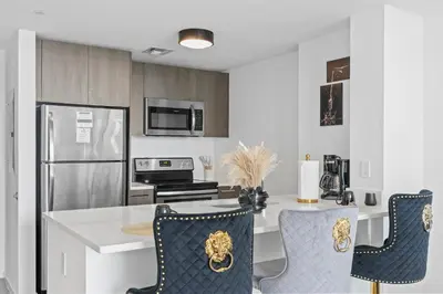 a kitchen with a table and two chairs at Miami Luxury Suite Infinity Pool in Miami