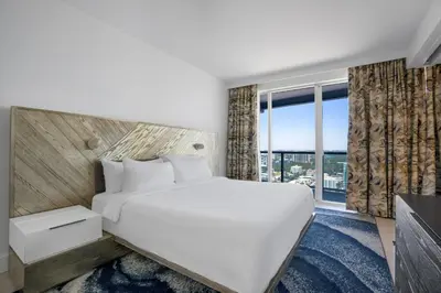 a bedroom with a large bed and a large window at WVR Vacation Residences 2306 in Fort Lauderdale