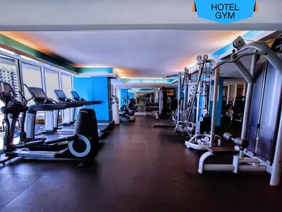 a gym with several treadmills and machines in it at WVR Vacation Residences 2306 in Fort Lauderdale