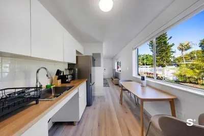 a kitchen with a table and a large window at Cozy 1-BD Miami Apt Gym, BBQ, Free Parking in Miami