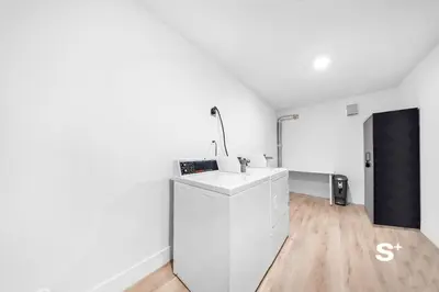 a white kitchen with a sink in a room at Chic 1-BD Apt in Miami Gym, BBQ, Free Parking in Miami