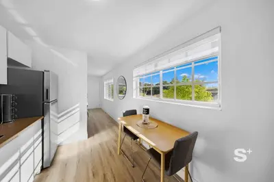 a kitchen and dining room with a table and a window at Miami Retreat - 1-BR Parking, Gym & BBQ Area in Miami