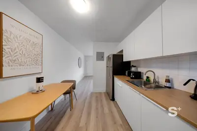 a kitchen with a sink and a counter top at Modern 1-BD Miami Apt Gym, BBQ, Free Parking in Miami