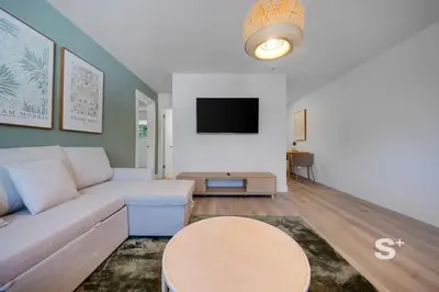 a living room with a couch and a table at Stylish 1-BD Apt Gym, BBQ, Free Parking in Miami