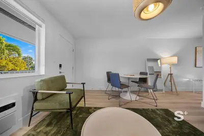 a living room with a table and chairs at Modern 1-BD Miami Apt Gym, BBQ, Free Parking in Miami